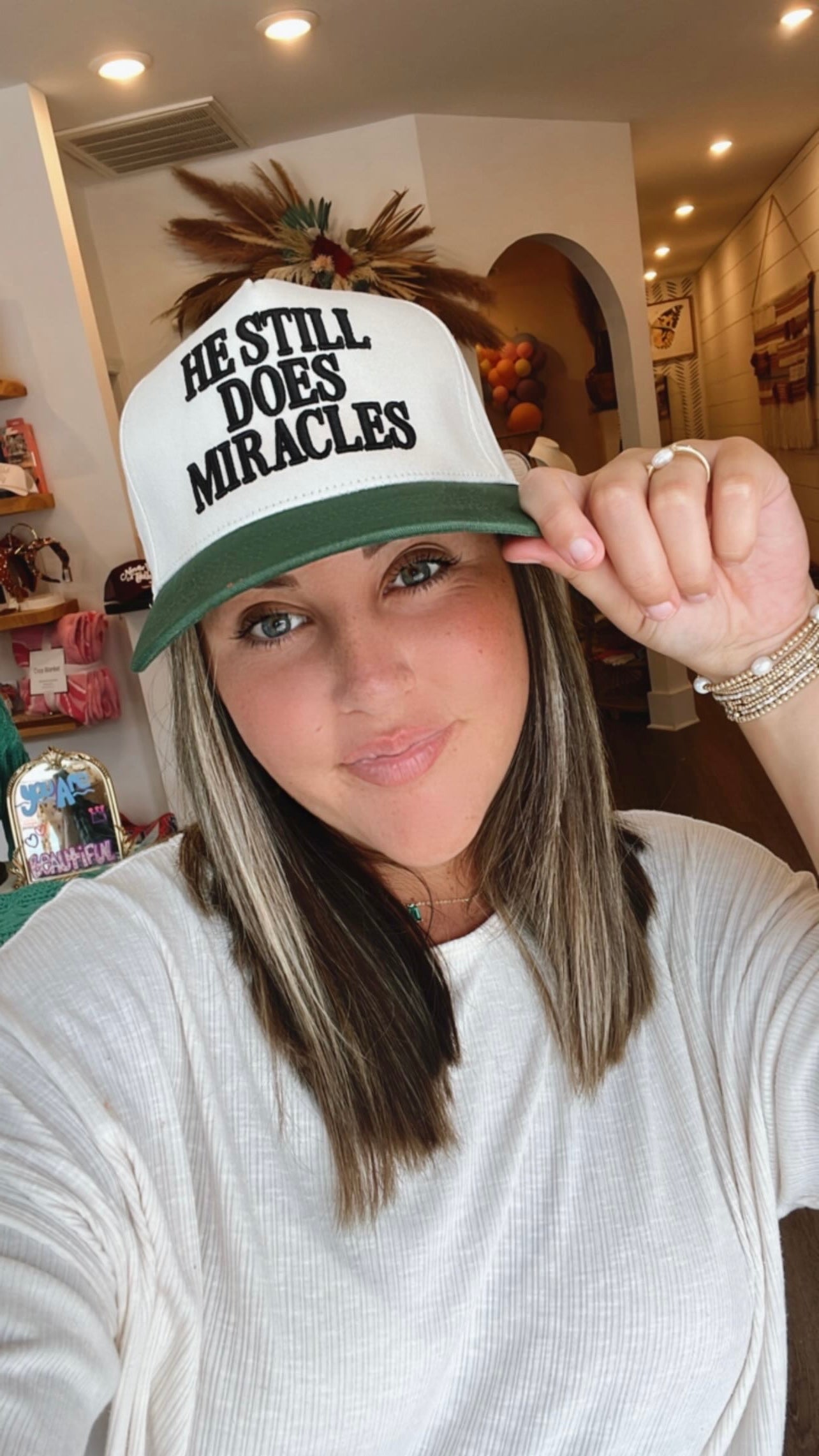 He Still Does Miracles Trucker Hat