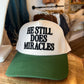 He Still Does Miracles Trucker Hat